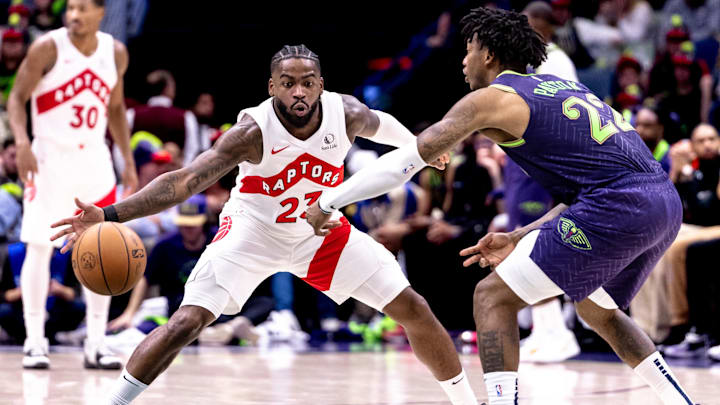 Nov 27, 2024; New Orleans, Louisiana, USA; Toronto Raptors guard Jamal Shead (23) misses a steal on a pas by New Orleans Pelicans guard Elfrid Payton (22) during the second half at Smoothie King Center. Mandatory Credit: Stephen Lew-Imagn Images Nov 27, 2024; New Orleans, Louisiana, USA; Toronto Raptors guard Jamal Shead (23) misses a steal on a pas by New Orleans Pelicans guard Elfrid Payton (22) during the second half at Smoothie King Center. Mandatory Credit: Stephen Lew-Imagn Images