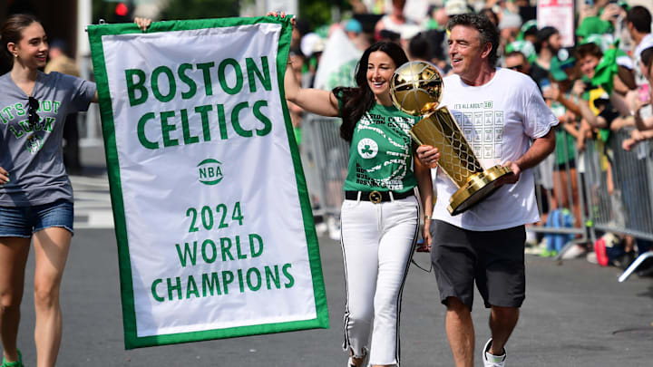 Jun 21, 2024; Boston, MA, USA;  Boston Celtics majority owner Wyc Grousbeck holds the Larry OíBrien trophy prior to the Boston Celtics championship parade. Mandatory Credit: Bob DeChiara-Imagn Images