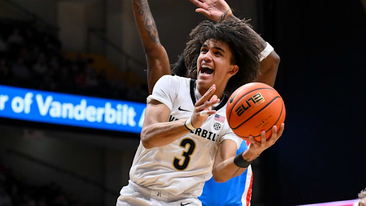 Jan 31, 2026; Nashville, TN, USA;  Vanderbilt Commodores guard Tyler Tanner (3) shoots the ball over Mississippi Rebels guard AJ Storr (2) during the second half at Memorial Gymnasium. Mandatory Credit: Steve Roberts-Imagn Images