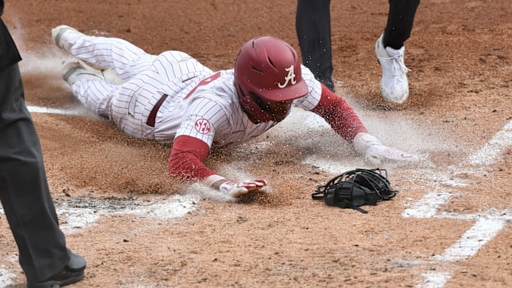 Feb 17, 2024; Tuscaloosa, Alabama, USA; Alabama base runner TJ McCants scores during the game with