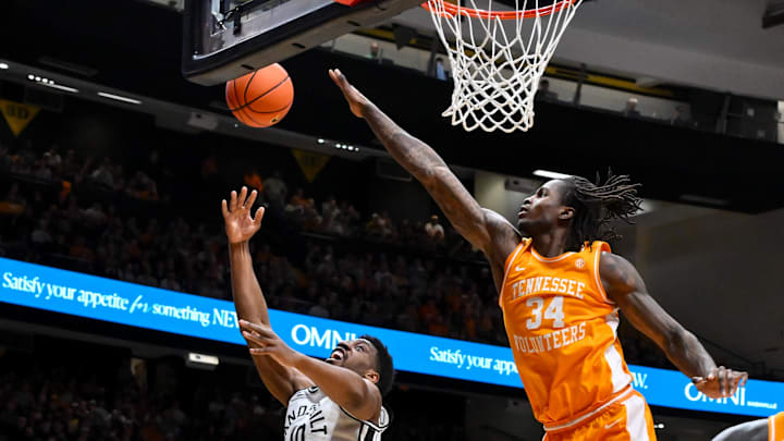Feb 21, 2026; Nashville, Tennessee, USA;  Vanderbilt Commodores forward Ak Okereke (10) shoots the ball over Tennessee Volunteers center Felix Okpara (34) during the second half at Memorial Gymnasium. Mandatory Credit: Steve Roberts-Imagn Images