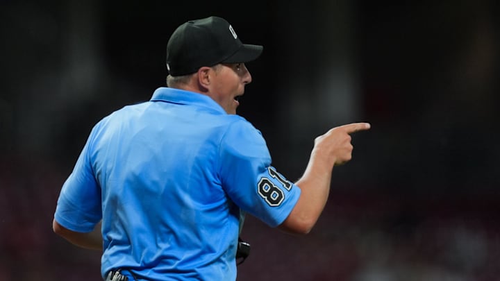 Apr 15, 2026; Cincinnati, Ohio, USA; Umpire Quinn Wolcott gestures to San Francisco Giants pitcher JT Brubaker, not pictured, during the game against the Cincinnati Reds in the seventh inning at Great American Ball Park. Players and coaches will wear No. 42 in honor of Jackie Robinson Day around the league. Mandatory Credit: Aaron Doster-Imagn Images Apr 15, 2026; Cincinnati, Ohio, USA; Umpire Quinn Wolcott gestures to San Francisco Giants pitcher JT Brubaker, not pictured, during the game against the Cincinnati Reds in the seventh inning at Great American Ball Park. Players and coaches will wear No. 42 in honor of Jackie Robinson Day around the league. Mandatory Credit: Aaron Doster-Imagn Images