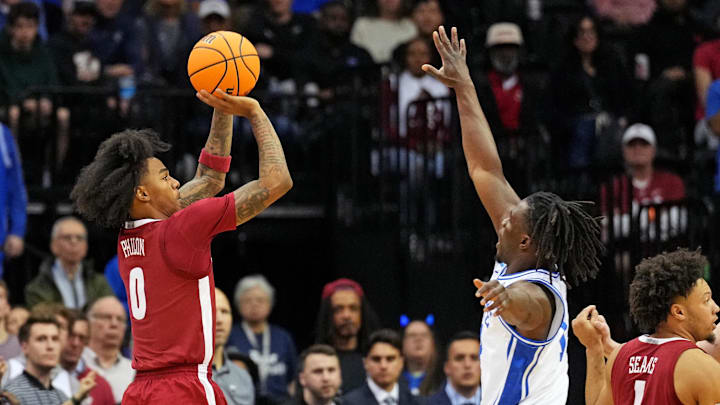 Mar 29, 2025; Newark, NJ, USA; Alabama Crimson Tide guard Labaron Philon (0) shoots the ball against Duke Blue Devils guard Sion James (14) during the second half in the East Regional final of the 2025 NCAA tournament at Prudential Center. Mandatory Credit: Robert Deutsch-Imagn Images