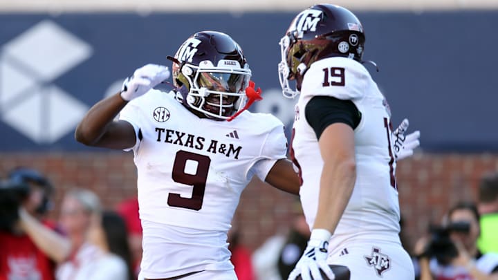 Nov 4, 2023; Oxford, Mississippi, USA; Texas A&M Aggies wide receiver Jahdae Walker (9) races with tight end Jake Johnson (19) after a touchdown during the second half against the Mississippi Rebels at Vaught-Hemingway Stadium. Mandatory Credit: Petre Thomas-USA TODAY Sports