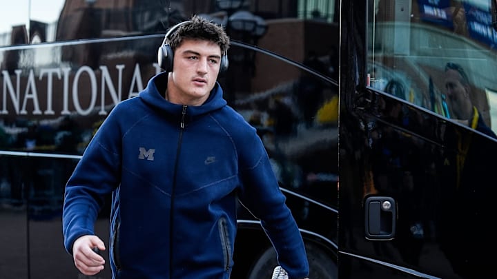 Michigan tight end Colston Loveland (18) walks off the bus during team arrival before the Michigan State game at Michigan Stadium in Ann Arbor on Saturday, Oct. 26, 2024.