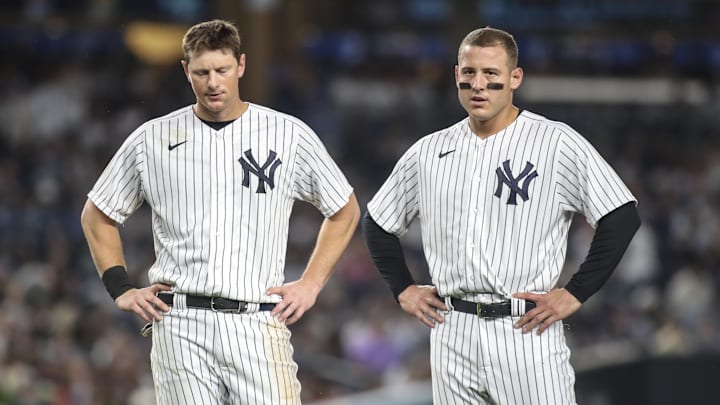 Jun 23, 2023; Bronx, New York, USA; New York Yankees third baseman DJ LeMahieu (26) and first baseman Anthony Rizzo (48) stand on the field after a double play to end the seventh inning against the Texas Rangers at Yankee Stadium. Mandatory Credit: Wendell Cruz-Imagn Images