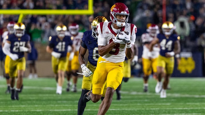Oct 18, 2025; South Bend, Indiana, USA; Southern California Trojans wide receiver Ja'Kobi Lane (8) completes a reception against the Notre Dame Fighting Irish during the second half at Notre Dame Stadium. Mandatory Credit: Michael Caterina-Imagn Images