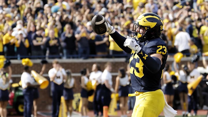 Oct 18, 2025; Ann Arbor, Michigan, USA;  Michigan Wolverines linebacker Cole Sullivan (23) celebrates after he makes an interception in the second half at Michigan Stadium. Mandatory Credit: Rick Osentoski-Imagn Images
