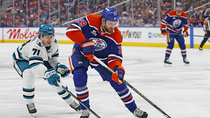 Jan 29, 2026; Edmonton, Alberta, CAN; Edmonton Oilers forward Leon Draisaitl (29) protects the puck from San Jose Sharks forward Macklin Celebrini (71) during the third periodat Rogers Place. Mandatory Credit: Perry Nelson-Imagn Images