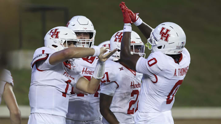 Sep 6, 2025; Houston, Texas, USA; Houston Cougars quarterback Conner Weigman (1) celebrates with teammates after scoring a touchdown during the third quarter against the Rice Owls at Rice Stadium. Mandatory Credit: Troy Taormina-Imagn Images Sep 6, 2025; Houston, Texas, USA; Houston Cougars quarterback Conner Weigman (1) celebrates with teammates after scoring a touchdown during the third quarter against the Rice Owls at Rice Stadium. Mandatory Credit: Troy Taormina-Imagn Images