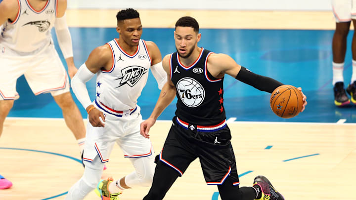Feb 17, 2019; Charlotte, NC, USA; Team Giannis guard Russell Westbrook of the Oklahoma City Thunder (0) defends Team Lebron guard Ben Simmons of the Philadelphia 76ers (25) during the All Star Game at Spectrum Center. Mandatory Credit: Jeremy Brevard-Imagn Images