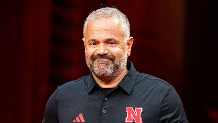 Aug 28, 2025; Kansas City, Missouri, USA; Nebraska Cornhuskers head coach Matt Rhule walks onto the field during warmups before the game against the Cincinnati Bearcats at GEHA Field at Arrowhead Stadium. Mandatory Credit: Dylan Widger-Imagn Images