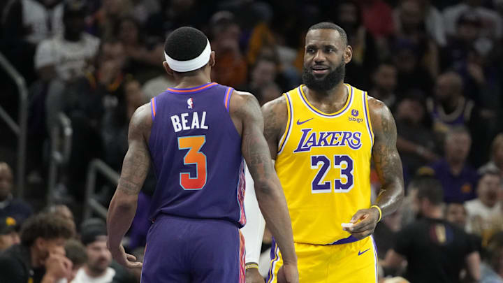 Nov 10, 2023; Phoenix, Arizona, USA; Los Angeles Lakers forward LeBron James (23) and Phoenix Suns guard Bradley Beal (3) talk in the second half at Footprint Center. Mandatory Credit: Rick Scuteri-Imagn Images