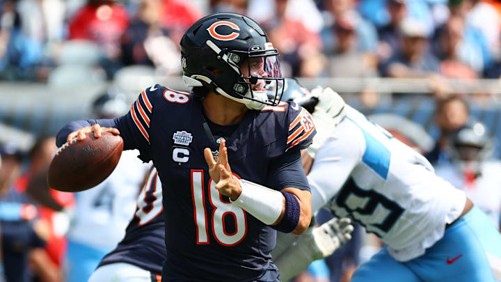 Sep 8, 2024; Chicago, Illinois, USA; Chicago Bears quarterback Caleb Williams (18) drops back to pass during the second half against the Tennessee Titans at Soldier Field. Sep 8, 2024; Chicago, Illinois, USA; Chicago Bears quarterback Caleb Williams (18) drops back to pass during the second half against the Tennessee Titans at Soldier Field.
