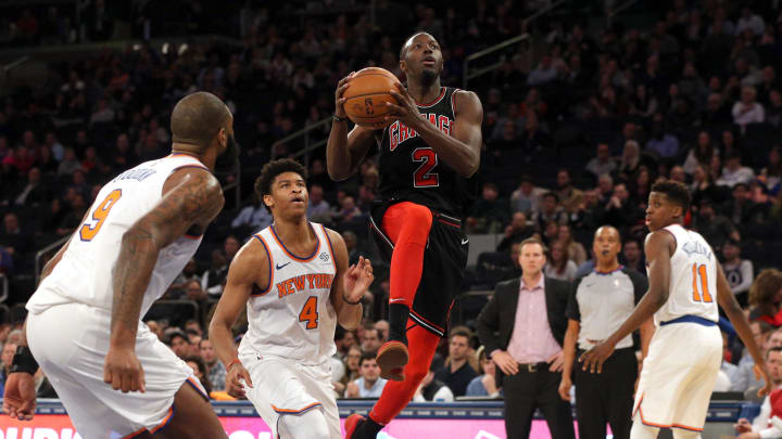 Mar 19, 2018; New York, NY, USA; Chicago Bulls point guard Jerian Grant (2) drives to the basket against New York Knicks center Kyle O'Quinn (9) and New York Knicks power forward Isaiah Hicks (4) during the fourth quarter at Madison Square Garden. Mandatory Credit: Brad Penner-USA TODAY Sports