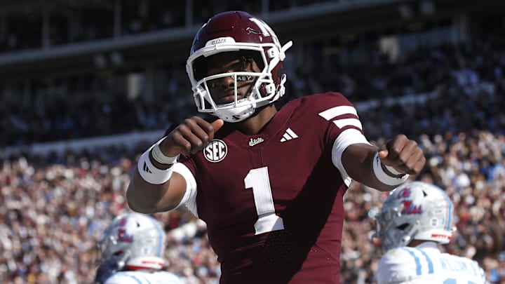 Mississippi State Bulldogs quarterback Kamario Taylor (1) celebrates after scoring a touchdown against the Mississippi Rebels in the first half at Davis Wade Stadium at Scott Field.