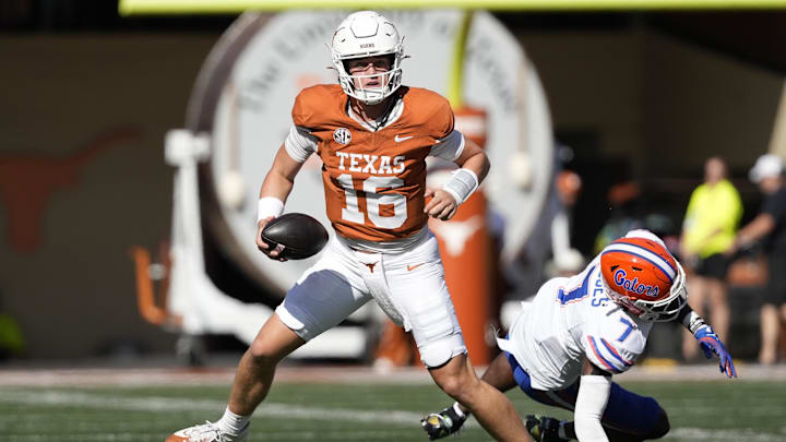 Nov 9, 2024; Austin, Texas, USA; Texas Longhorns quarterback Arch Manning (16) escapes Florida Gators defensive back	Trikweze Bridges (7) while looking to pass during the second half at Darrell K Royal-Texas Memorial Stadium. Mandatory Credit: Scott Wachter-Imagn Images