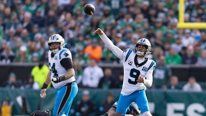 Dec 8, 2024; Philadelphia, Pennsylvania, USA;  Carolina Panthers quarterback Bryce Young (9) passes the ball while being hit by Philadelphia Eagles defensive tackle Jalen Carter (98) during the first quarter at Lincoln Financial Field. Mandatory Credit: Bill Streicher-Imagn Images