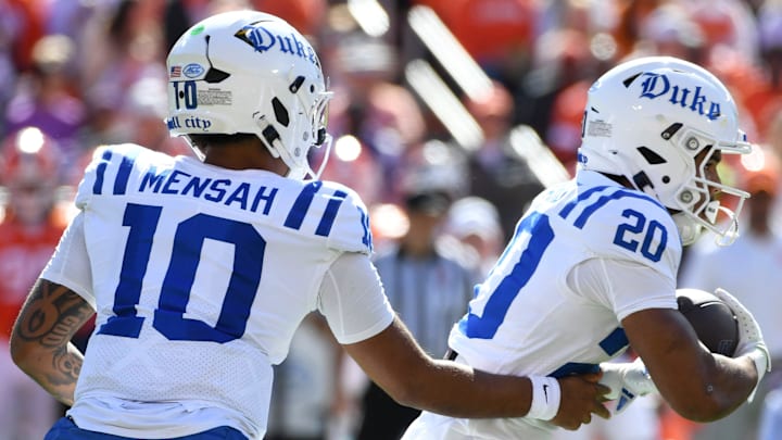 Duke Blue Devils quarterback Darian Mensah (10) hands the ball off to Duke Blue Devils running back Nate Sheppard (20) Saturday, Nov. 1, 2025, during the NCAA football game against the Clemson Tigers at Memorial Stadium in Clemson, South Carolina. Duke Blue Devils quarterback Darian Mensah (10) hands the ball off to Duke Blue Devils running back Nate Sheppard (20) Saturday, Nov. 1, 2025, during the NCAA football game against the Clemson Tigers at Memorial Stadium in Clemson, South Carolina.