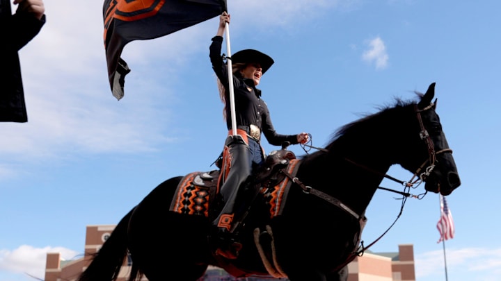 Spirit Rider Avery Langley rides Bullet after a score in the first half of the college football game between the Oklahoma State Cowboys and the Iowa State Cyclones at Boone Pickens Stadium in Stillwater, Okla., Saturday Nov. 29, 2025.