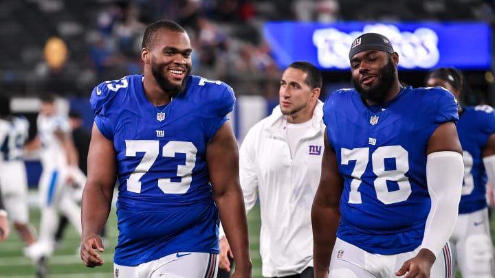 Aug 18, 2023; East Rutherford, New Jersey, USA; New York Giants offensive tackle Evan Neal (73) and New York Giants offensive tackle Andrew Thomas (78) exit the field after defeating the Carolina Panthers at MetLife Stadium. Mandatory Credit: John Jones-USA TODAY Sports Aug 18, 2023; East Rutherford, New Jersey, USA; New York Giants offensive tackle Evan Neal (73) and New York Giants offensive tackle Andrew Thomas (78) exit the field after defeating the Carolina Panthers at MetLife Stadium. Mandatory Credit: John Jones-USA TODAY Sports