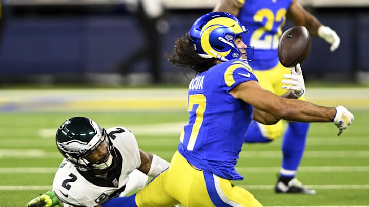 Nov 24, 2024; Inglewood, California, USA;  Los Angeles Rams wide receiver Puka Nacua (17) juggles a pass dropped, defended by Philadelphia Eagles cornerback Darius Slay Jr. (2) during the first half at SoFi Stadium. Mandatory Credit: Alex Gallardo-Imagn Images