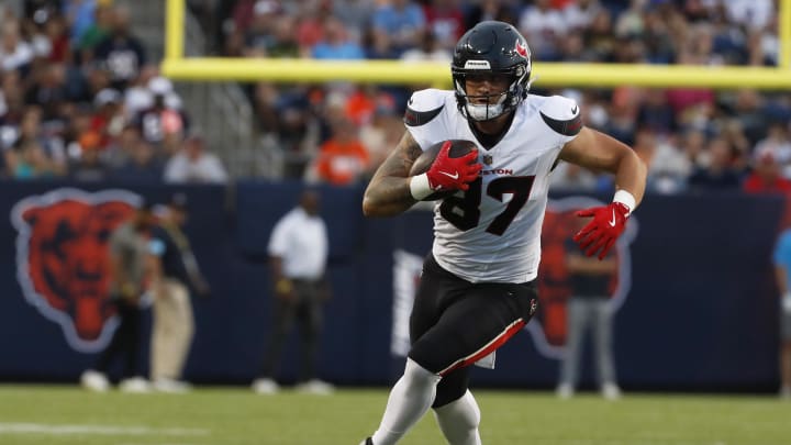 Aug 1, 2024; Canton, Ohio, USA; Houston Texans tight end Cade Stover (87) runs after a catch against the Chicago Bears during the first quarter at Tom Benson Hall of Fame Stadium. Mandatory Credit: Charles LeClaire-USA TODAY Sports Aug 1, 2024; Canton, Ohio, USA; Houston Texans tight end Cade Stover (87) runs after a catch against the Chicago Bears during the first quarter at Tom Benson Hall of Fame Stadium. Mandatory Credit: Charles LeClaire-USA TODAY Sports