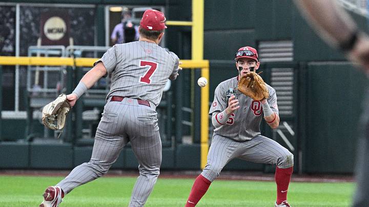 Oklahoma Sooners shortstop Jaxon Willits (7) tosses to second baseman Kyle Branch (6) at Charles Schwab Field.