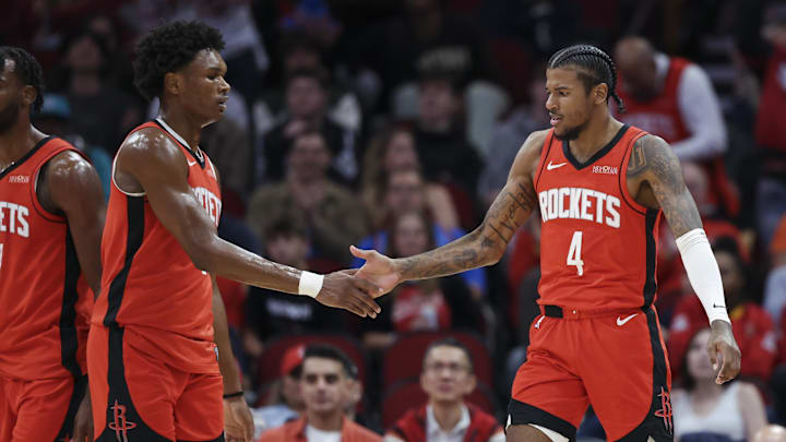 Dec 1, 2024; Houston, Texas, USA; Houston Rockets guard Jalen Green (4) celebrates with forward Amen Thompson (1) after a play during the game against the Oklahoma City Thunder at Toyota Center. Mandatory Credit: Troy Taormina-Imagn Images