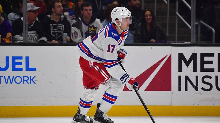Jan 20, 2026; Los Angeles, California, USA; New York Rangers defenseman Will Borgen (17) moves the puck against the Los Angeles Kings during the second period at Crypto.com Arena. Mandatory Credit: Gary A. Vasquez-Imagn Images