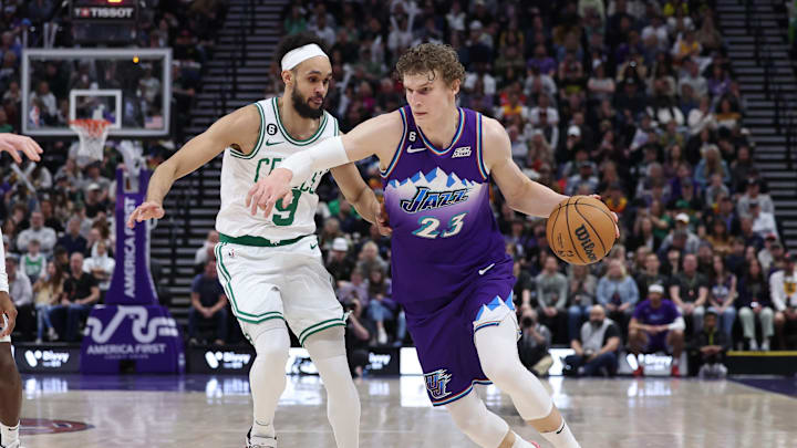 Mar 18, 2023; Salt Lake City, Utah, USA; Utah Jazz forward Lauri Markkanen (23) drive past Boston Celtics guard Derrick White (9) in the third quarter at Vivint Arena. Mandatory Credit: Rob Gray-Imagn Images Mar 18, 2023; Salt Lake City, Utah, USA; Utah Jazz forward Lauri Markkanen (23) drive past Boston Celtics guard Derrick White (9) in the third quarter at Vivint Arena. Mandatory Credit: Rob Gray-Imagn Images
