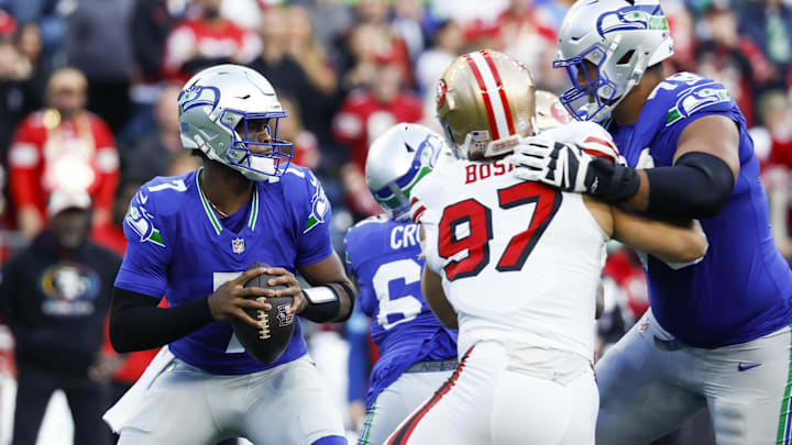 Oct 10, 2024; Seattle, Washington, USA; Seattle Seahawks quarterback Geno Smith (7) looks to pass against the San Francisco 49ers during the first quarter at Lumen Field. Mandatory Credit: Joe Nicholson-Imagn Images Oct 10, 2024; Seattle, Washington, USA; Seattle Seahawks quarterback Geno Smith (7) looks to pass against the San Francisco 49ers during the first quarter at Lumen Field. Mandatory Credit: Joe Nicholson-Imagn Images