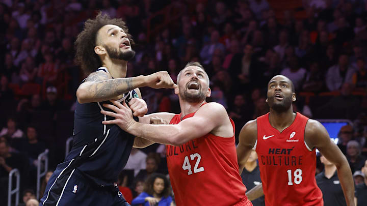 Nov 24, 2024; Miami, Florida, USA;  Dallas Mavericks center Dereck Lively II (2), Miami Heat forward Kevin Love (42) and Miami Heat guard Alec Burks (18) wait for a rebound during the second half  at Kaseya Center. Mandatory Credit: Rhona Wise-Imagn Images