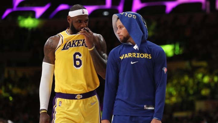 Oct 19, 2021; Los Angeles, California, USA; Los Angeles Lakers forward LeBron James (6) talks to Golden State Warriors guard Stephen Curry (30) during the second half at Staples Center. The Warriors won 121-114. Mandatory Credit: Kiyoshi Mio-USA TODAY Sports