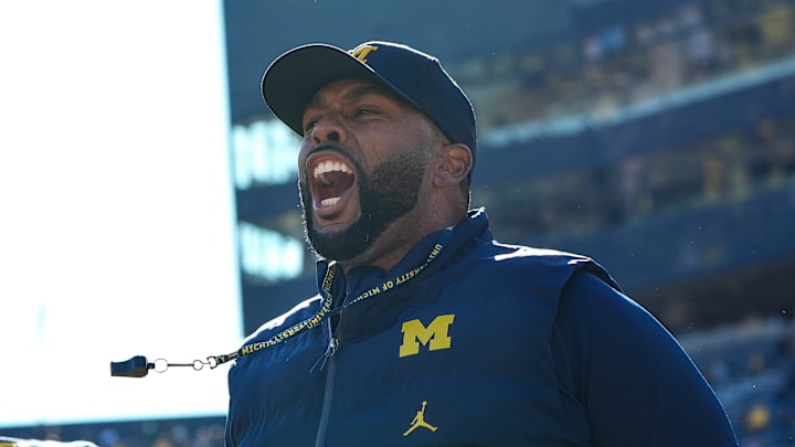 Michigan head coach Sherrone Moore cheers on during warm up before the Oregon game at Michigan Stadium in Ann Arbor on Saturday, Nov. 2, 2024.
