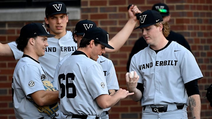 Vanderbilt pitcher Sawyer Hawks, right, talks with teammates before a NCAA college baseball game against Tennessee Tech at Hawkins Field Tuesday, Feb. 25, 2025, in Nashville, Tenn.