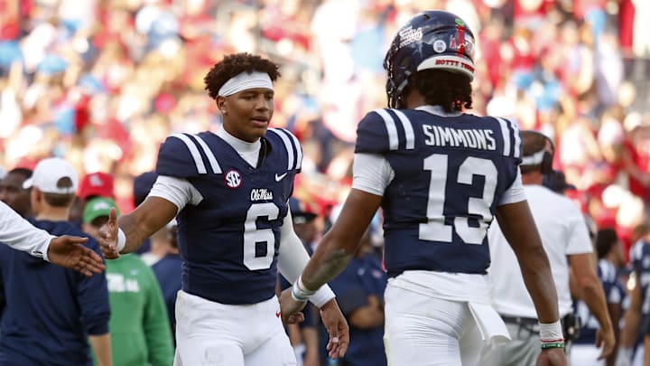 Nov 8, 2025; Oxford, Mississippi, USA; Mississippi Rebels quarterback Trinidad Chambliss (6) reacts with quarterback Austin Simmons (13) during the fourth quarter against The Citadel Bulldogs at Vaught-Hemingway Stadium. Mandatory Credit: Petre Thomas-Imagn Images