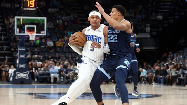Mar 28, 2023; Memphis, Tennessee, USA; Orlando Magic forward Paolo Banchero (5) drives to the basket as Memphis Grizzlies guard Desmond Bane (22) defends during the first half at FedExForum. Mandatory Credit: Petre Thomas-Imagn Images Mar 28, 2023; Memphis, Tennessee, USA; Orlando Magic forward Paolo Banchero (5) drives to the basket as Memphis Grizzlies guard Desmond Bane (22) defends during the first half at FedExForum. Mandatory Credit: Petre Thomas-Imagn Images