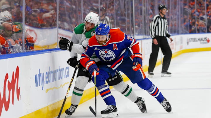 Edmonton Oilers center Leon Draisaitl (29) checks Dallas Stars defenseman Miro Heiskanen (4) 