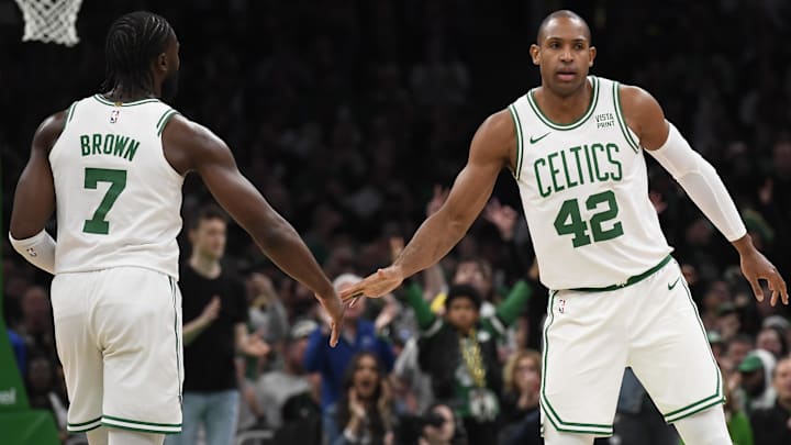 Apr 21, 2024; Boston, Massachusetts, USA; Boston Celtics center Al Horford (42) is congratulated by guard Jaylen Brown (7) after a basket during the second half in game one of the first round for the 2024 NBA playoffs against the Miami Heat at TD Garden. Mandatory Credit: Bob DeChiara-Imagn Images