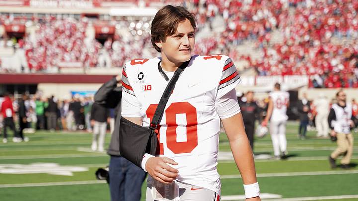 Oct 17, 2026; Bloomington, Indiana, USA; Ohio State Buckeyes quarterback Julian Sayin (10) walks off the field with his arm in a sling after the game against the Indiana Hoosiers Merchants Bank Field at Memorial Stadium. Mandatory Credit: Robert Goddin-Imagn Images
