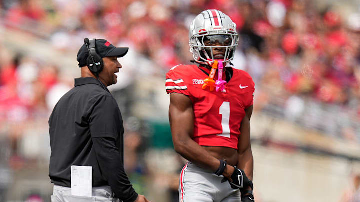 Aug 31, 2024; Columbus, OH, USA; Ohio State Buckeyes secondary coach Tim Walton talks to cornerback Davison Igbinosun (1) during the first half of the NCAA football game against the Akron Zips at Ohio Stadium. Aug 31, 2024; Columbus, OH, USA; Ohio State Buckeyes secondary coach Tim Walton talks to cornerback Davison Igbinosun (1) during the first half of the NCAA football game against the Akron Zips at Ohio Stadium.
