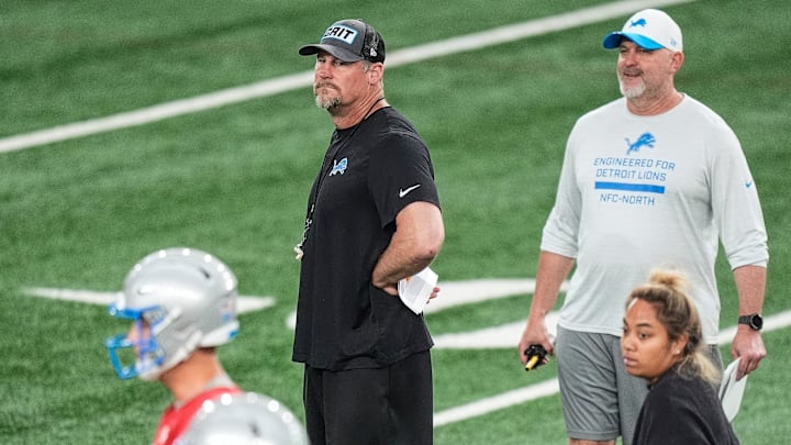 Detroit Lions head coach Dan Campbell, center, and offensive coordinator John Morton watch practice during OTAs at Meijer Performance Center in Allen Park on Thursday, June 5, 2025. Detroit Lions head coach Dan Campbell, center, and offensive coordinator John Morton watch practice during OTAs at Meijer Performance Center in Allen Park on Thursday, June 5, 2025.