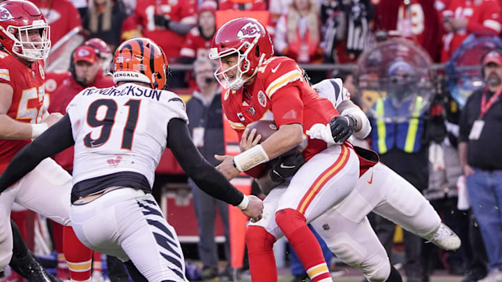 Jan 30, 2022; Kansas City, Missouri, USA; Kansas City Chiefs quarterback Patrick Mahomes (15) is sacked by Cincinnati Bengals defensive end B.J. Hill (92) and defensive end Trey Hendrickson (91) during the AFC Championship game at GEHA Field at Arrowhead Stadium. Mandatory Credit: Denny Medley-Imagn Images