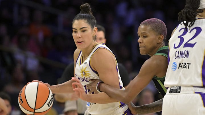 Jul 10, 2025; Los Angeles, California, USA;  Los Angeles Sparks guard Kelsey Plum (10) drives past Minnesota Lynx guard Courtney Williams (10) in the second half at Crypto.com Arena. Mandatory Credit: Jayne Kamin-Oncea-Imagn Images