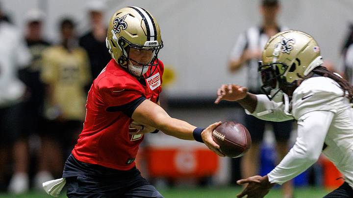 Aug 02, 2026; Metairie, LA, USA; New Orleans Saints quarterback Zach Wilson (4) hands off to running back Alvin Kamara (41) during training camp at Ochsner Sports Performance Center. Mandatory Credit: Stephen Lew-Imagn Images Aug 02, 2026; Metairie, LA, USA; New Orleans Saints quarterback Zach Wilson (4) hands off to running back Alvin Kamara (41) during training camp at Ochsner Sports Performance Center. Mandatory Credit: Stephen Lew-Imagn Images