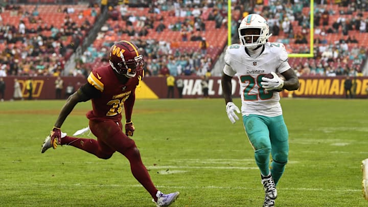 Dec 3, 2023; Landover, Maryland, USA; Miami Dolphins running back De'Von Achane (28) scores a