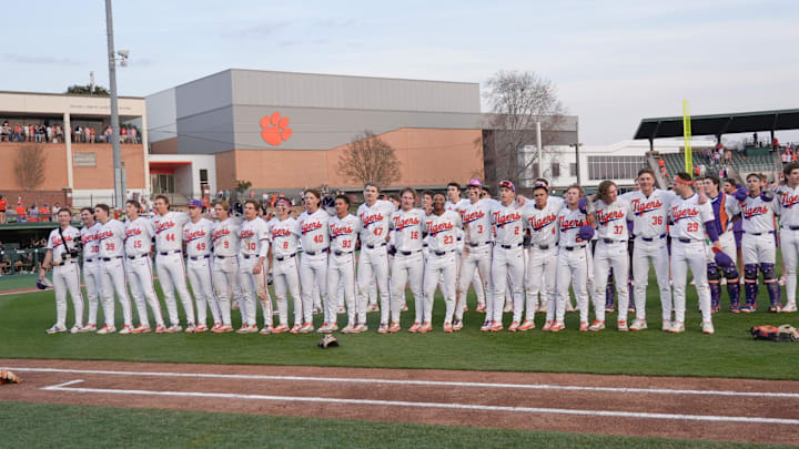 Clemson players join in the alma mater after the game at Doug Kingsmore Stadium in Clemson, S.C. Sunday, March 1, 2026. Clemson won the game 7-2 and the series with state rival University of South Carolina 2-1.