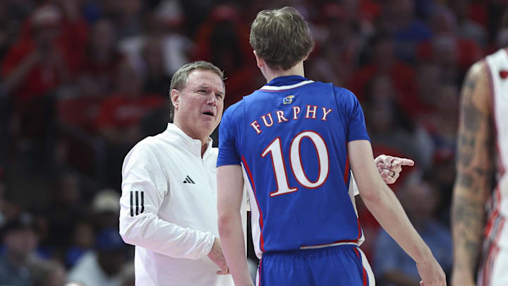 Mar 9, 2024; Houston, Texas, USA; Kansas Jayhawks head coach Bill Self talks with guard Johnny Furphy (10) during the second half against the Houston Cougars at Fertitta Center. Mandatory Credit: Troy Taormina-Imagn Images