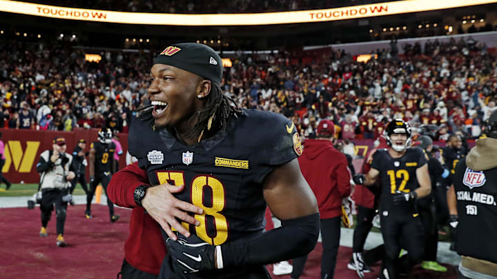 Washington Commanders linebacker Jordan Magee celebrates after beating the Chicago Bears on a Hail Mary pass
